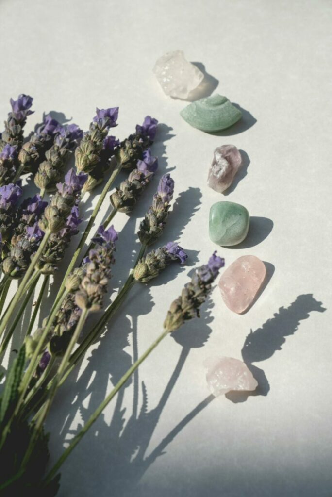 Sunlit still life of lavender and healing crystals creating a serene ambiance.